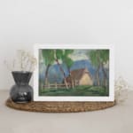Vintage wall art of a countryside cottage with green trees and soft blue mountains. displayed on the wall
