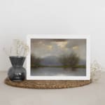 Vintage reflective landscape wall art with soft grays, blues, and greens, showing water reflections, bare trees, and low hills. displayed on the wall