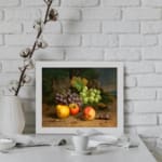 Vintage fruit still life wall art with grapes, apples, peaches, and plums on a rustic surface and dark leafy background. displayed on the wall
