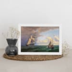 Vintage nautical wall art with two elegant sailboats on a deep green ocean under a dramatic sky. displayed on the wall