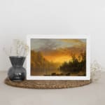 Infidu vintage sunset wall art showcasing calm water, tall trees, and a glowing sky in warm tones of orange, yellow, and brown. displayed on the wall