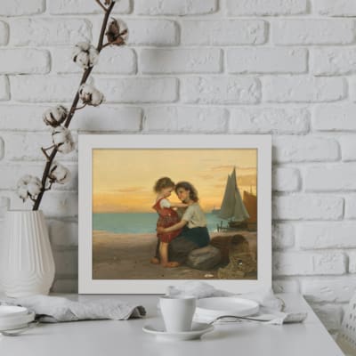 Vintage wall art of two children by the seaside with a pastel sky, calm sea, and warm tones, evoking nostalgia and peace. displayed on the wall in a white frame