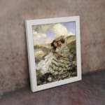 Vintage wall art showing two women in flowing dresses sitting on a grassy hillside with a dog, under a blue sky with white clouds. displayed on the wall