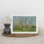 Vintage wall art of a spring meadow with a blossoming tree in soft pink, green, and blue tones by Infidu. displayed on the wall