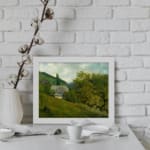 Vintage countryside wall art with green hills, trees, and a gray-roofed house in a calm rural setting. displayed on the wall