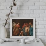 Vintage religious wall art with an angel and three figures in muted robes on a dark background. displayed on the wall