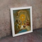 Vintage wall art of angels surrounding a glowing golden sacred symbol with soft clouds and light in the background. displayed on the wall