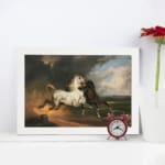 Vintage wall art of a white and dark brown horse in motion under a stormy sky with dramatic clouds and open fields. displayed on the wall