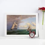 Vintage nautical wall art with two elegant sailboats on a deep green ocean under a dramatic sky. displayed on the wall