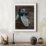 Vintage wall art of two women in traditional clothing by a wooden fence in a rustic countryside setting. displayed on the wall
