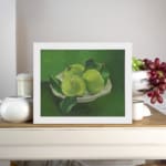 Infidu Vintage Green Apples in White Bowl Still Life Wall Art showcasing green apples in a white bowl with a soft green background. displayed on the wall