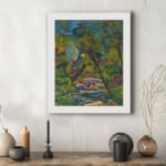 Vintage wall art of a vibrant forest with a colorful flowing stream and expressive brushstrokes. displayed on the wall