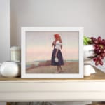 Vintage wall art of a woman on a grassy cliff overlooking the sea, wearing a red headscarf and holding a jug, in soft earthy tones. displayed on the wall