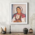 Vintage wall art of Eastern European woman in traditional red and white clothing with embroidered details. displayed on the wall
