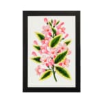 Infidu vintage wall art with soft pink flowers and green leaves. hung on the wall