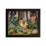 Vintage wall art of a brown rabbit sitting in a lush green forest with trees and plants in the background. hung on the wall