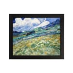 Infidu vintage countryside wall art with green hills and swirling blue sky. hung on the wall