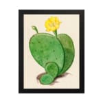 Vintage cactus wall art with a green cactus and yellow flower on a beige background, framed in black. hung on the wall