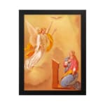 Vintage wall art of an angel and praying woman with glowing light and warm cloudy sky background. hung on the wall