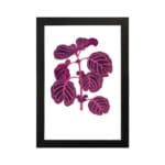 Vintage wall art showing a purple leafy plant with pink veins on a white background, framed in black. hung on the wall