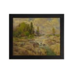 Vintage wall art of a rocky stream with green trees and a cloudy sky in warm earthy tones of brown, green, and yellow. hung on the wall