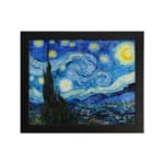 Vincent van Gogh’s The Starry Night vintage wall art shows swirling blue sky, bright yellow stars, a crescent moon, a tree silhouette, and a village. hung on the wall