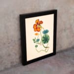 Vintage floral wall art with orange-red flower and green twisting vines on a beige background. displayed on the wall