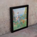 Vintage wall art of a woman in a garden with pastel flowers, ocean view, and soft countryside details. displayed on the wall