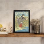 Infidu vintage wall art featuring a Japanese woman in a kimono with intricate details, set against a scenic background of blue sky, flowers, and water. displayed on the table in a black frame