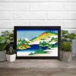 Infidu vintage wall art featuring a serene mountain lake with towering peaks, calm reflective waters, and surrounding trees. displayed on the wall art in a black frame