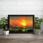 Infidu vintage ocean sunset wall art with fiery sky, waves, and glowing sun in bold colors of orange, red, yellow, and green. displayed on the wall