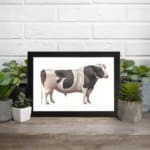 Vintage black and white cow wall art in clean, minimalist style with white background. displayed on the wall