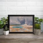 Vintage art of hot spring and erupting geyser with cloudy sky. displayed on the wall