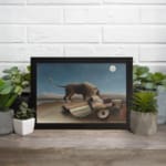 Infidu vintage wall art featuring a mysterious scene of a lion standing beside a sleeping person under a full moon in a serene, dreamlike landscape. displayed on the wall art in a black frame