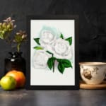 Vintage white rose wall art with green leaves and soft blue background. displayed on the wall