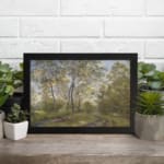 Infidu vintage wall art showing a peaceful forest path in soft green tones with trees, a dirt trail, and a blue sky. displayed on the wall