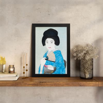 Vintage wall art of a graceful Japanese woman in a soft-toned kimono holding a fan. displayed on the wall
