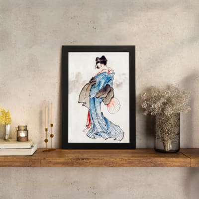 Vintage wall art of a Japanese woman in a soft blue kimono with a fan, styled with calm brush strokes and traditional details. displayed on the wall