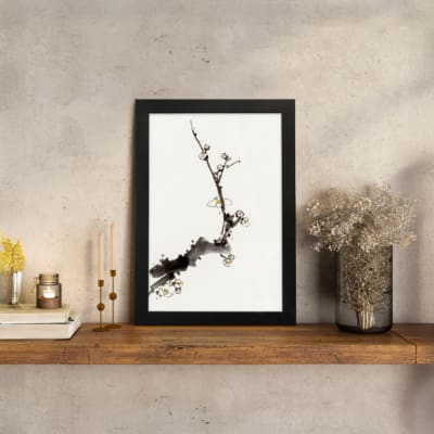 Minimal blossom branch vintage wall art in black and light brown on white background. displayed on the wall