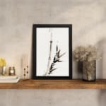 Vintage ink bamboo wall art in Zen brush style with black and gray tones on a white background. displayed on the wall