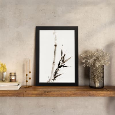 Vintage ink bamboo wall art in Zen brush style with black and gray tones on a white background. displayed on the wall