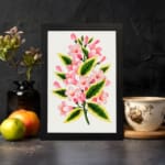 Infidu vintage wall art with soft pink flowers and green leaves. displayed on the wall
