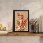 Vintage botanical wall art with red and white flowers and green leaves on a tan background. displayed on the wall