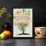 Infidu vintage wall art of a delicate pink blossom tree with green leaves and a white background. displayed on the wall