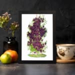 Vintage floral wall art with purple blossoms, yellow centers, and green leaves on a white background. displayed on the wall