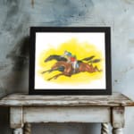 Vintage horse racing wall art with two galloping horses and jockeys on a bold yellow background. displayed on the wall