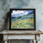 Infidu vintage countryside wall art with green hills and swirling blue sky. displayed on the wall