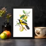 Yellow bird on a branch with green leaves and soft yellow fruits – Infidu vintage wall art displayed on the wall