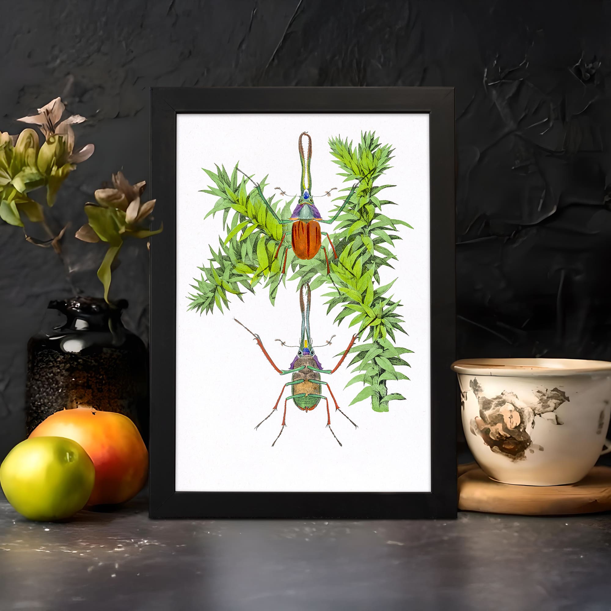 Vintage wall art featuring two colorful beetles and bright green leaves with a white background and black frame. displayed on the wall