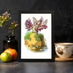 Vintage wall art of a plant with purple and red leaves on a mossy rock, set against a cream background and framed in black. displayed on the wall
